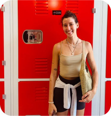 customer posing in front of a storage unit